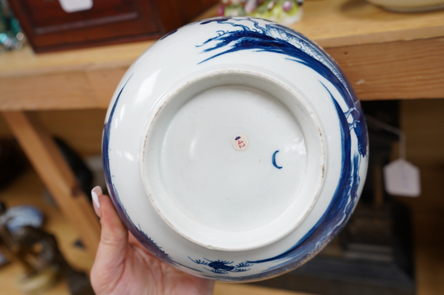 A Worcester coffee cup and saucer, Milkmaid pattern by Hancock, a pair of English porcelain shell salts, and a Worcester blue and white bowl, 18cm (5). Condition - fair